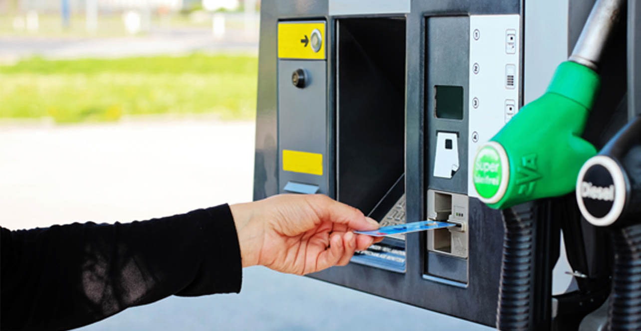 person paying for fuel by card