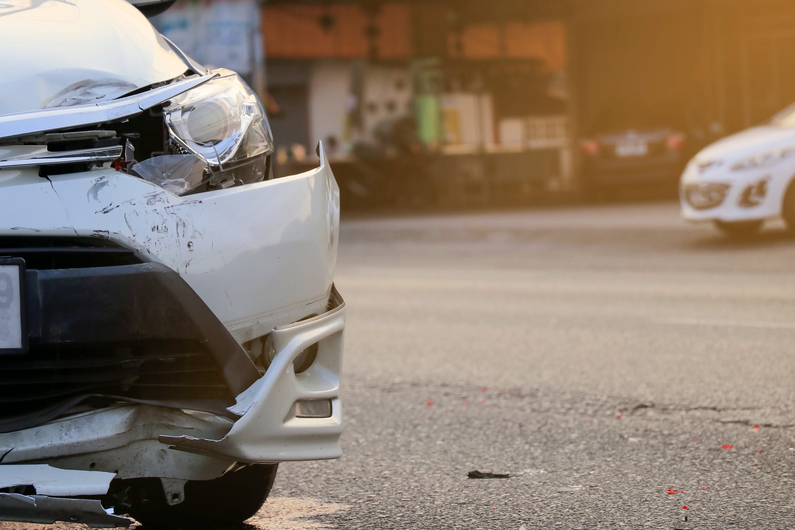 front bumper damaged on a fleet car after a road accident