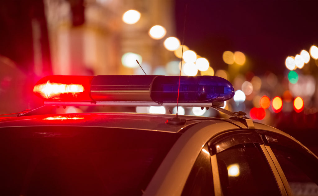 close up of emergency service, police vehicle flashing its lights